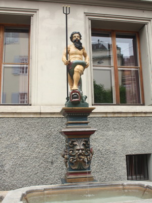 Statue of Neptune in Basel over a water fountain