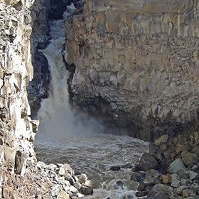 Malad River pluges in short waterfall into punchbowl