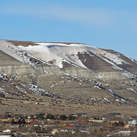 Pilot Butte looms up behind the northern suburbs of Rock Springs