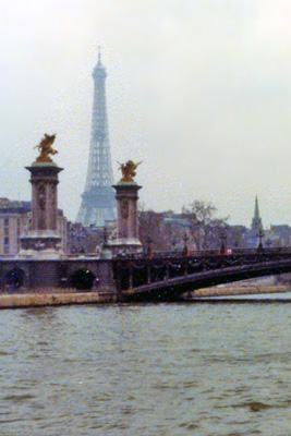 The Eiffel Tower looms behind the Alexander Bridge in Paris