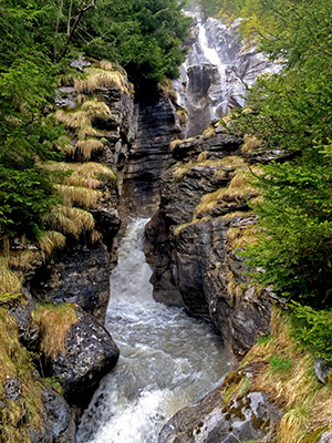 Water cascades down a narrow gorge of rocks