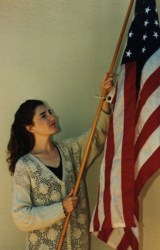 JoAnn S. with an American flag.