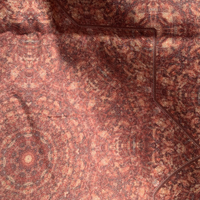 Sunlight shines on some fabric I designed ; this fabric is made from a scan of a polished stone, and I call it Granite Octagram and Cross