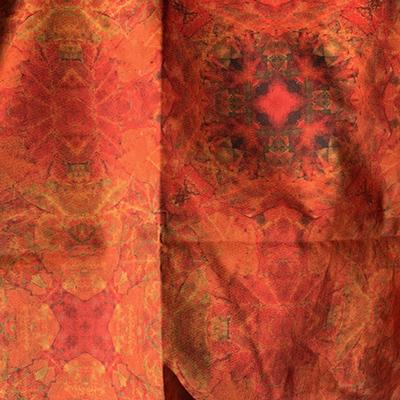 Orange fabric pattern made from leaves