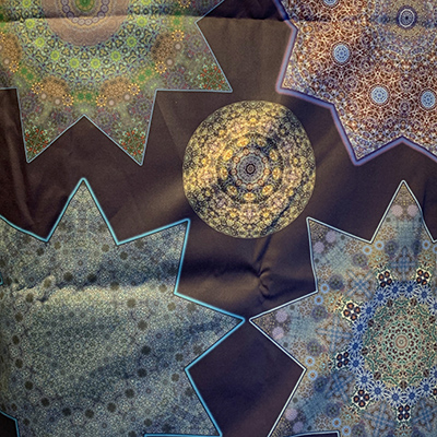 Sun shining on some fabric I designed; this design is Ottoman Stars and Orbs