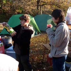 Micah and Sebastian prepare to cook