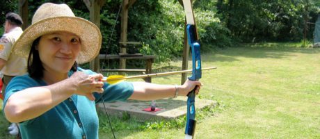 Jeri drawing her bow at Camp Drake Cub Scout Family Day in June of 2005