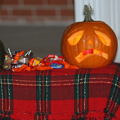 Candy on a table with a jack-o-lantern