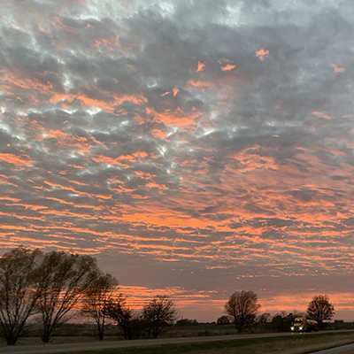 Sunset driving west on I-64 in central Illinois