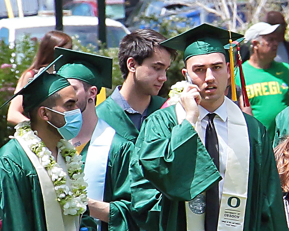 Graduates of the University of Oregon participating in events on graduation day, 2021