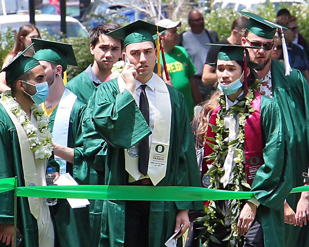 Graduates of the University of Oregon participating in events on graduation day, 2021