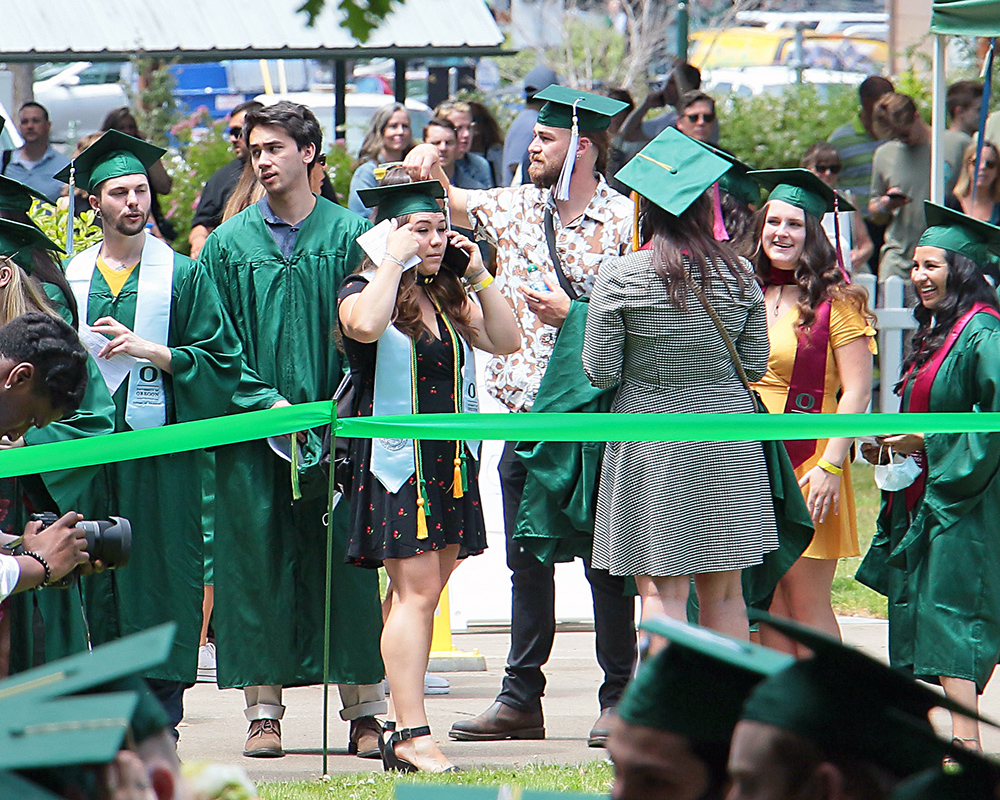 Graduates of the University of Oregon participating in events on graduation day, 2021