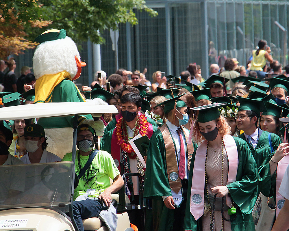 Graduates of the University of Oregon participating in events on graduation day, 2021