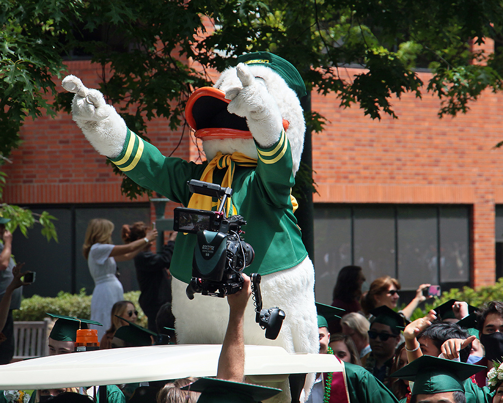 Graduates of the University of Oregon participating in events on graduation day, 2021