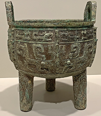 Brass tripod food vessel called a ding