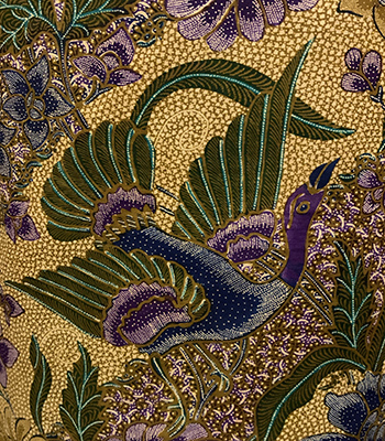A beautiful flying bird on a batik