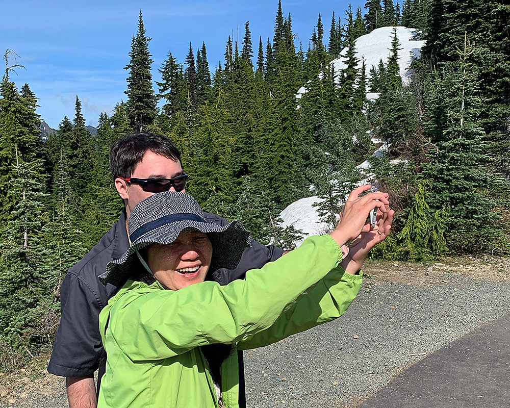 Sebastian and Jeri smile as they take a selfie on Hurricane Ridge