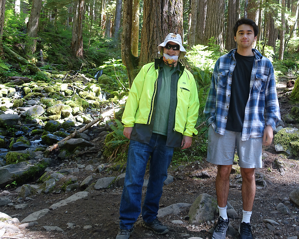 Sebastian and Arthur by a rocky stream