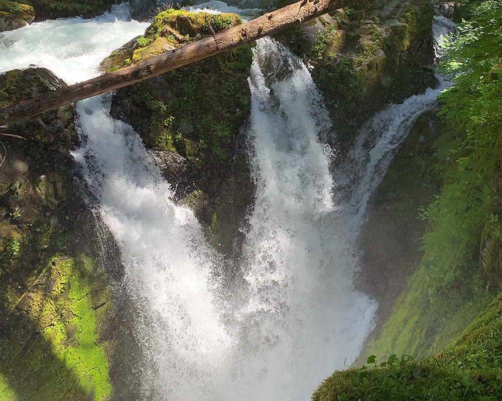 The Sol Duc River falls over a brink into a chasm