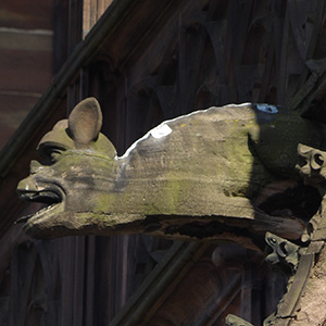 Jesus stands under an arch that proclaims he is the lamb of God