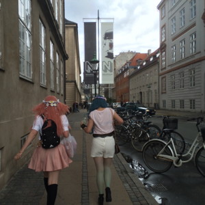 Two girls walking down the street in Copenhagen, Denmark.