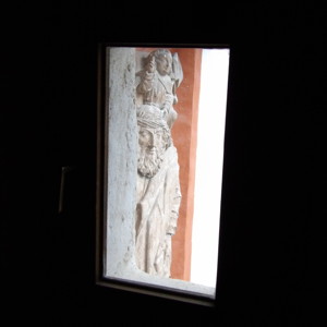 Another window view of a stone decoration in Hohensalzburg Castle.