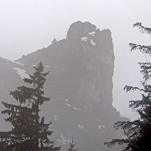 The Mysterious peak looms up in the mist, behind Gimmelwald