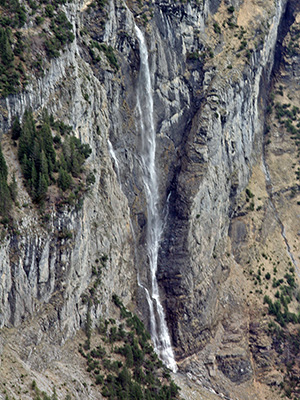 This is a waterfall in Switzerland, fowing down into the valley of the White Lütschine.