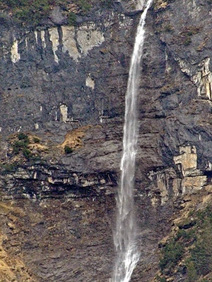 This is a waterfall in Switzerland, fowing down into the valley of the White Lütschine.