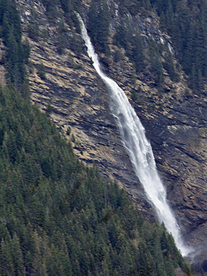 This is a waterfall in Switzerland, fowing down into the valley of the White Lütschine.