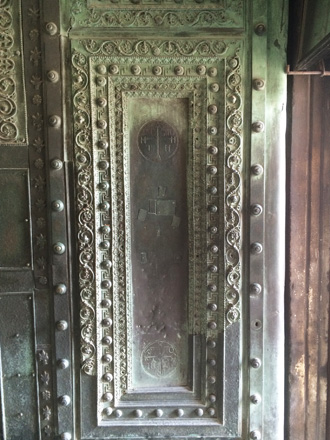Two-winged bronze door