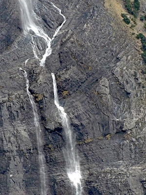 Water cascades down a narrow gorge of rocks